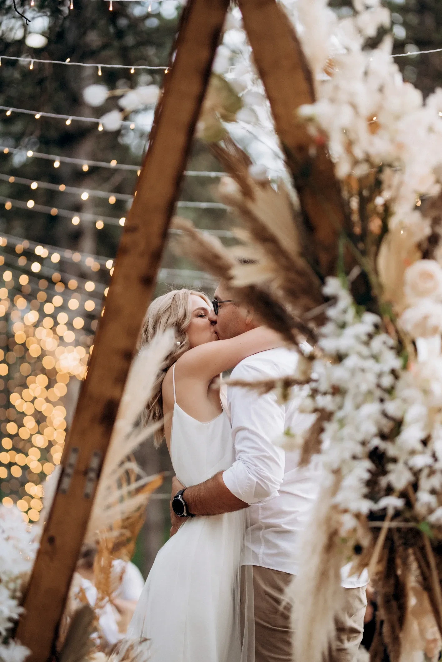 Couple among white flowers